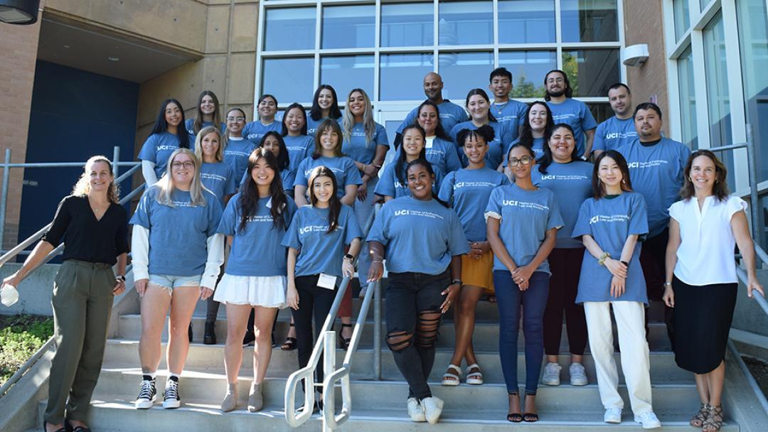 Flanked by Amanda Geller (front row, left) and Charis Kubrin (front row, right), co-directors of the university’s top-ranked online M.A.S. program in the subject, are some of the 95 students in the current cohort. Photo by Jessica Y. Gutierrez
